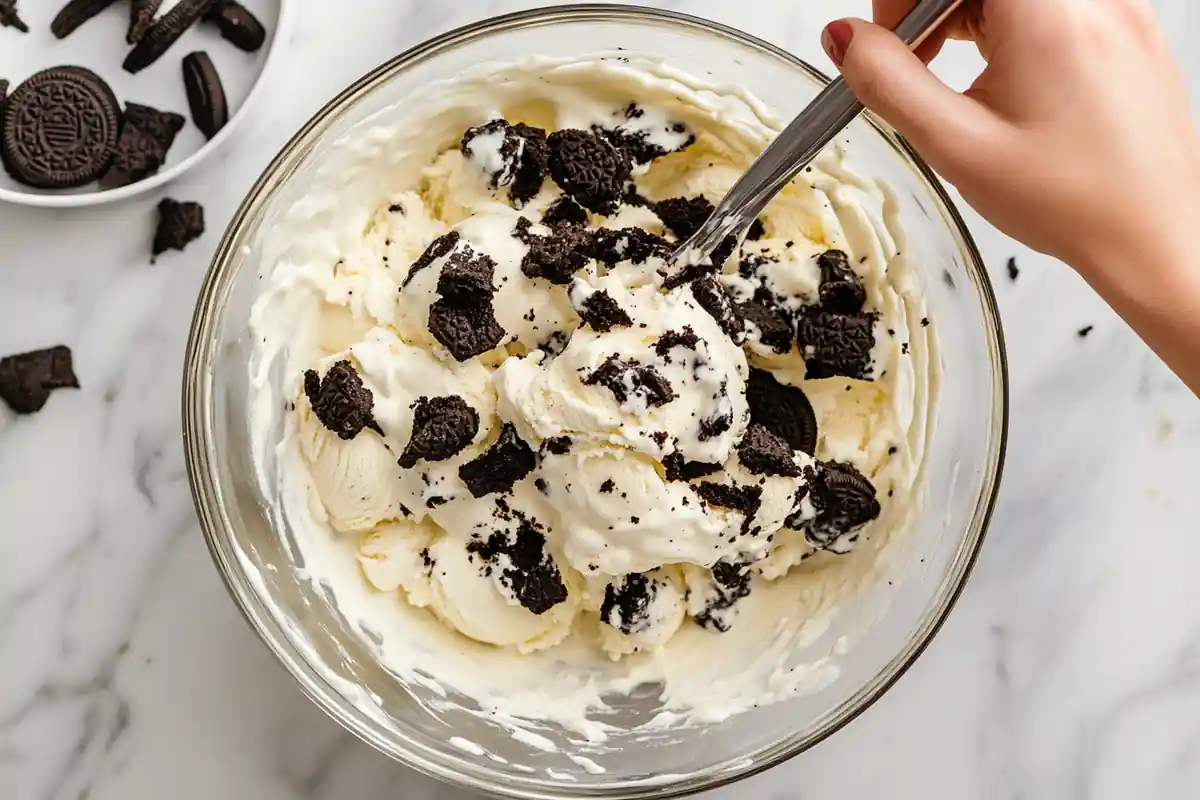 u6185574297 Step by step process mixing Oreo cookie chunks in 8deda17e 5a48 426b a417 6fa0698f31b4 2 www.noryrecipes.com